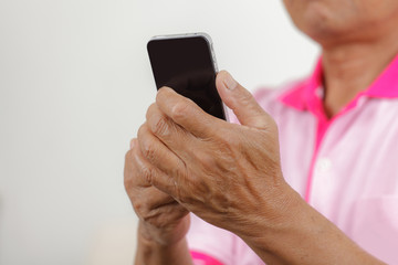 Senior man using phone