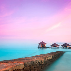Over water bungalows with steps into amazing green lagoon