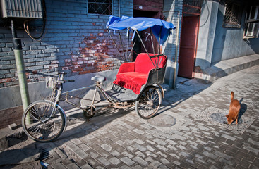 Fototapeta na wymiar cycle rickshaw on narrow alley in hutong area in Beijing, China