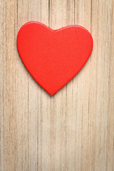 Red heart on book's pages background