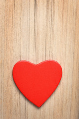 Red heart on book's pages background