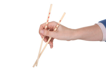 Female hand holding crossed chopsticks with chinese inscription