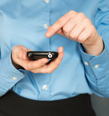 Close up of a woman using mobile smart phone