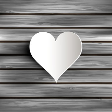 Abstract heart on wooden background