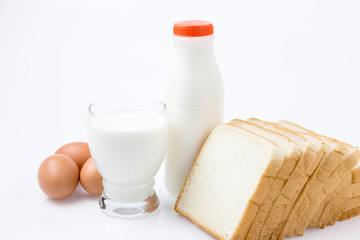 Milk Bottle,Glass, Egg and Bread on white Background