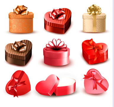 Set of colorful gift heart-shaped boxes with bows and ribbons. V