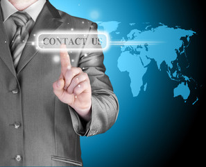 businessman hand pushing contact us button