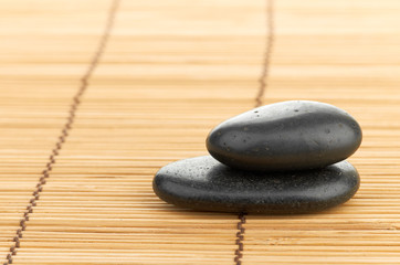 The spa a stone on bamboo background