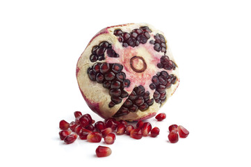 Ripe pomegranate fruit isolated on white background cutout