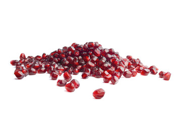 Pomegranate seeds over white background