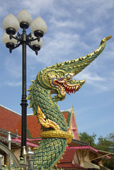 Fototapeta na wymiar Dragon sculpture on the territory of the Temple Wat Phokha Jutha
