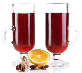 Mulled wine with lemon and spices isolated on white