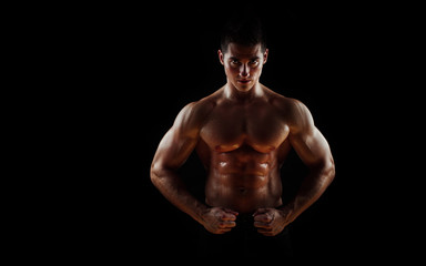 Fototapeta na wymiar Man with muscular torso isolated on black background, male tors