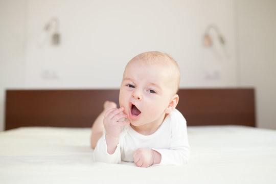 tired baby on sofa, Beautiful cute baby, drowsy baby