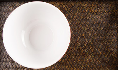A bowl on a woven tray