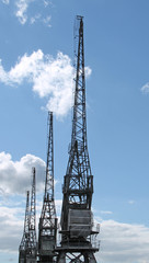 A Row of Traditional Dockside Cargo Cranes.