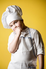 Little boy chef in uniform