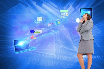 Composite image of smiling thoughtful businesswoman