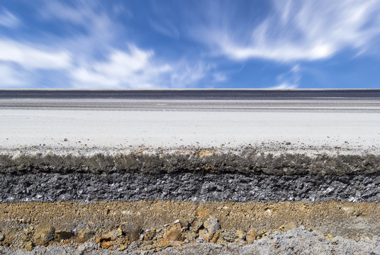 Empty asphalt road surface with lane perspective, transportation route for travel, traffic, infrastructure and mobility background, ideal for editorial travel, tourism and destination promotion.
