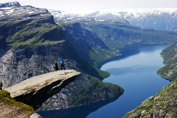 couple jumping on tongue of troll