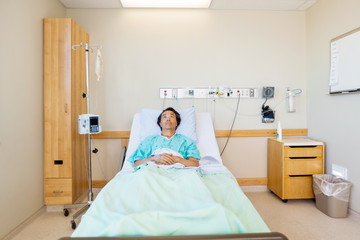Patient Reclining On Bed While Looking Up In Hospital