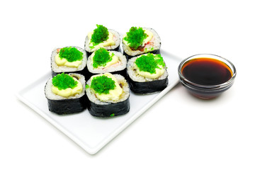 rolls and soy sauce on a white background