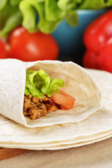 burrito with beef tomato and salad leaf