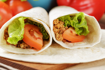 burritos with beef tomato and salad leaf
