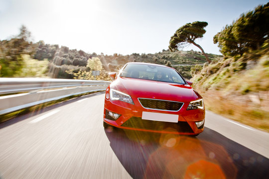 Fototapeta Car on a road full of dangerous bends
