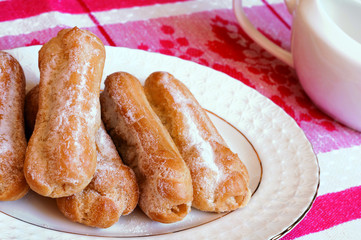 Appetizing eclairs with custard