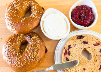 Homemade whole grain bagels with sesame seeds and cranberries.