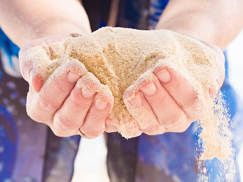 Hands Holding Sand