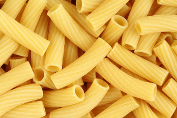 Uncooked tortiglioni pasta background