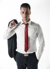 Attractive, serious young businessman with jacket and tie