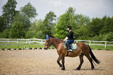 young girl riding a horse