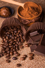 chocolate, coffee beans and cocoa on the burlap