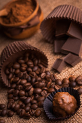 chocolate, coffee beans and cocoa on the burlap