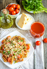 Whole heat fusilli pasta with cheese and cherry tomatoes