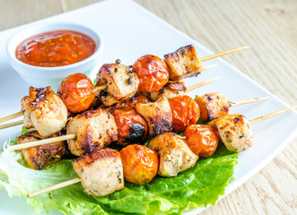 Grilled chicken skewers with cherry tomatoes