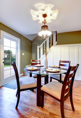 White and olive dining area with classic dining table set
