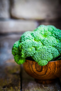 Broccoli on rustic wooden background