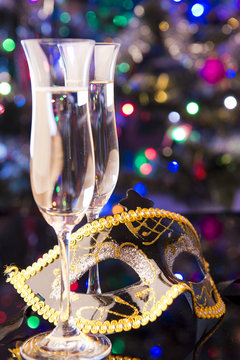 Two glasses of champagne and venetian mask