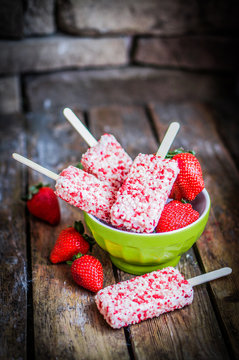 Strawberry ice cream on wooden background