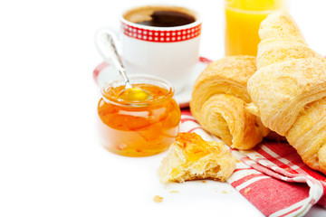 Continental breakfast with croissants, marmalade and coffee
