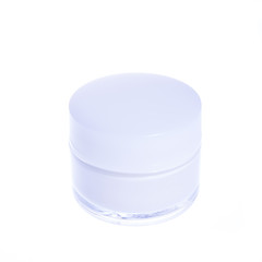 cosmetic cream in a glass jar with white cover