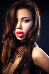 Fototapeta premium Portrait Of Sexy Woman On a dark metallic Background