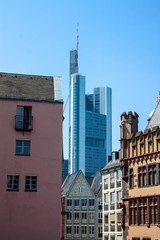 Fototapeta premium Contrast of old buildings and a skyscraper in Frankfurt, Germany