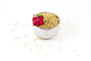 Uncooked brown rice on white background