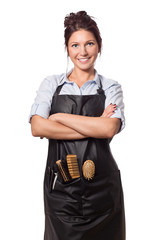 Professional hairdresser woman.In professional outfit with tools