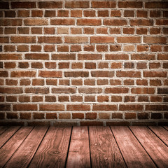 Red brick wall and wooden floor interior